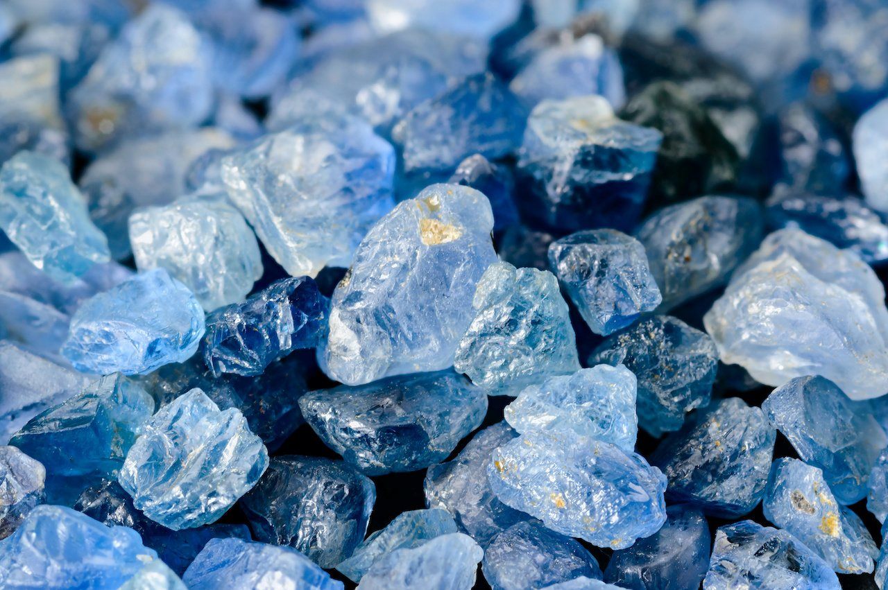 Pile of rough blue sapphire crystals