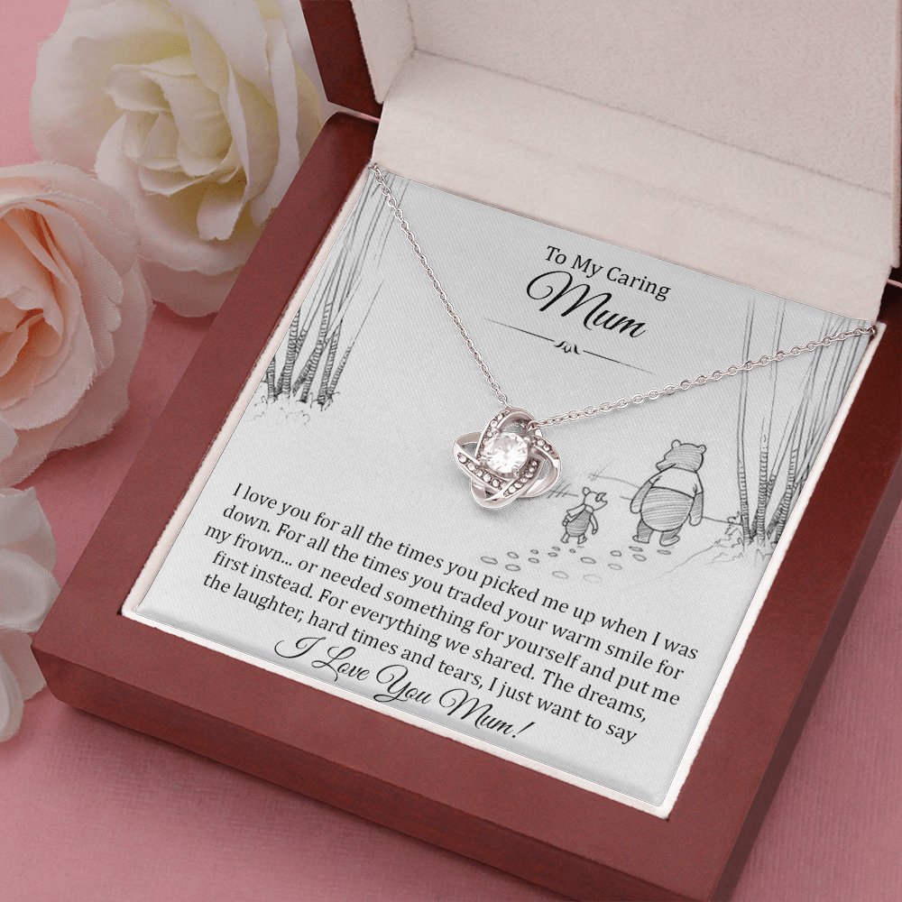Love Knot Necklace with To My Caring Mum card in a gift box beside a white rose