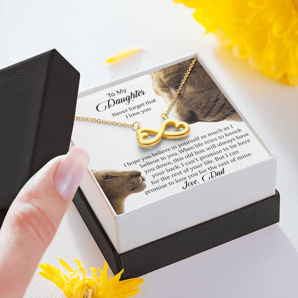 Hand holding the gift box with Infinity Necklace and To My Daughter card, yellow gold finish