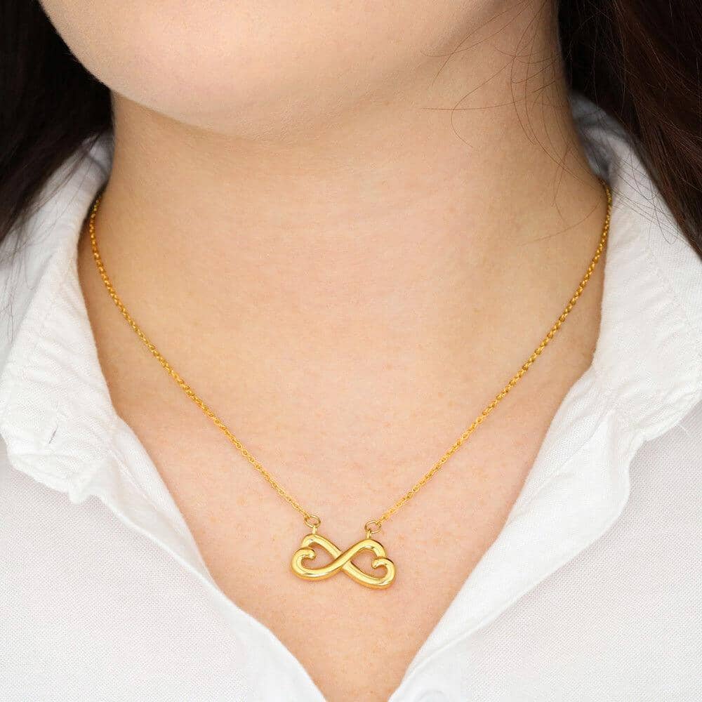 Model wearing the Infinity Necklace, yellow gold finish