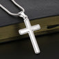 Personalized Cross Necklace pendant resting on a book