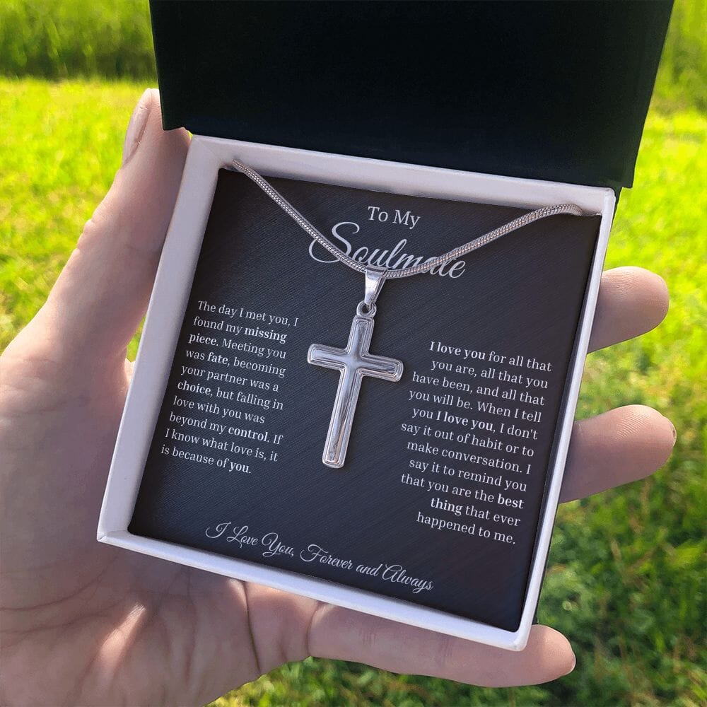 Hand holding the gift box with Personalized Cross Necklace and To My Soulmate card outdoors