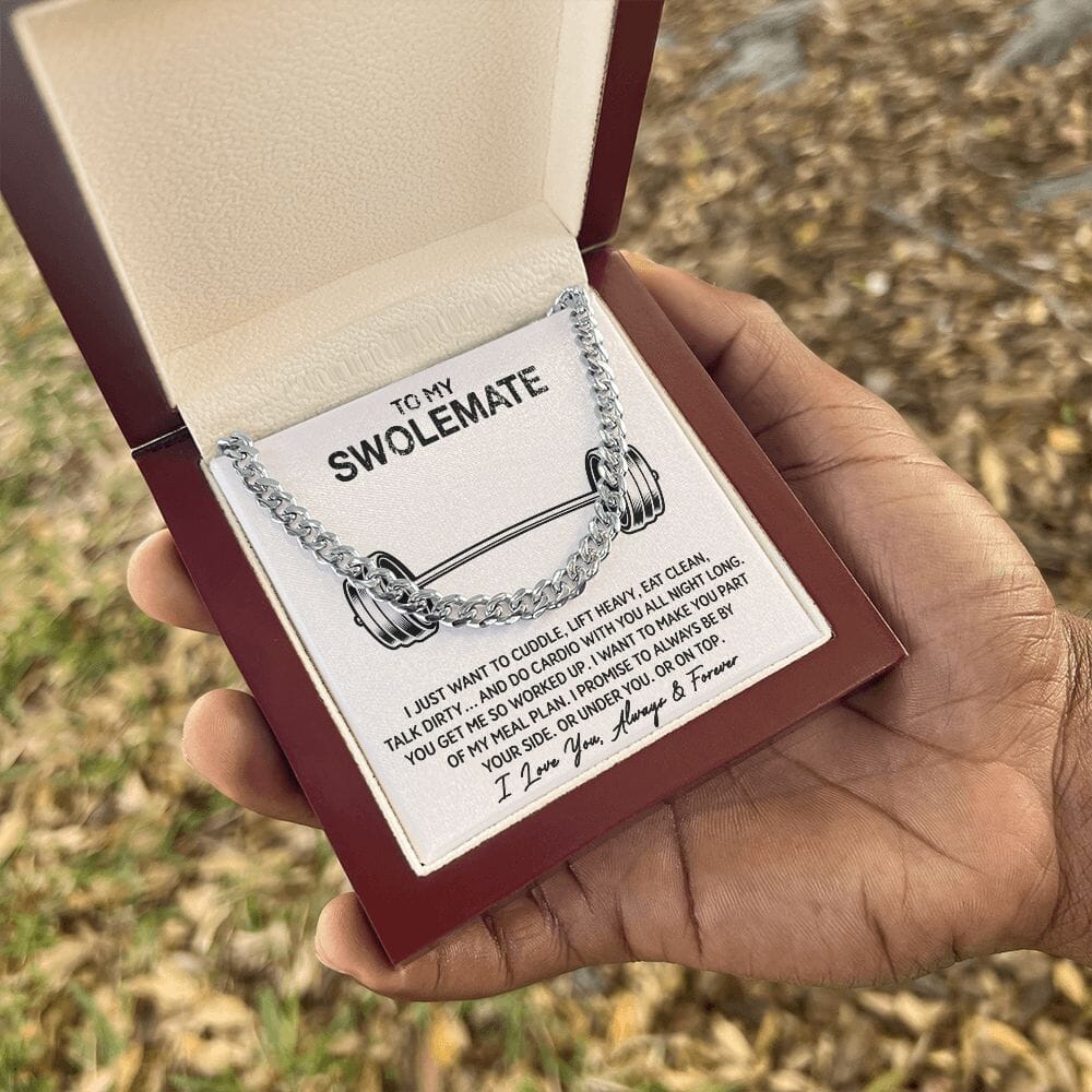 Hand holding the gift box with Cuban Link Chain Necklace and To My Swolemate card outdoors