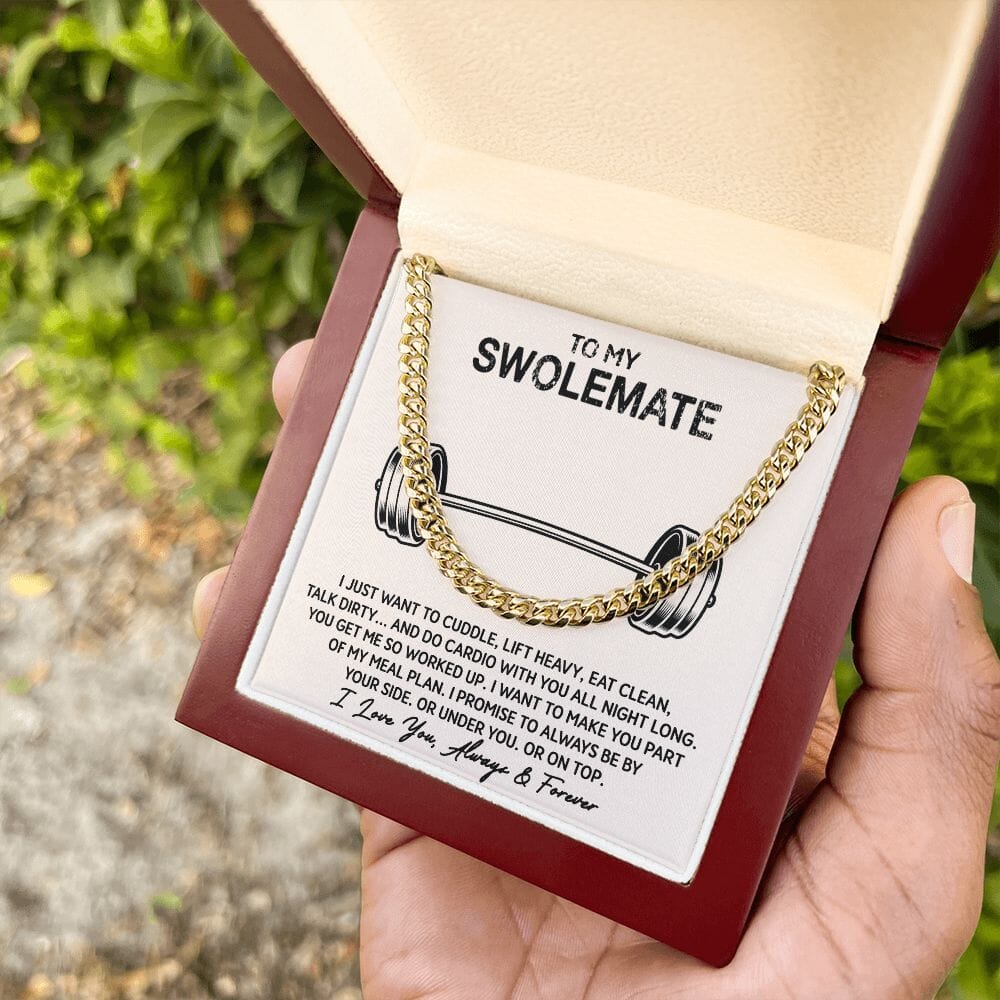 Hand holding the gift box with Cuban Link Chain Necklace and To My Swolemate card outdoors, yellow gold finish